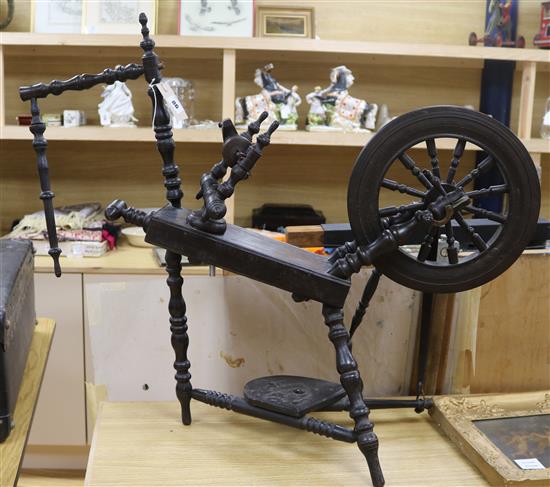 A 19th century ebonised spinning wheel